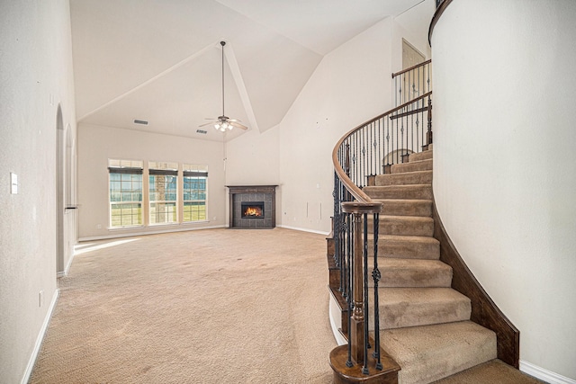 1432 Fence Post Dr, Fort Worth, TX 76052 - stairs featuring high vaulted ceiling, carpet flooring, a ceiling fan, a fireplace, and baseboards