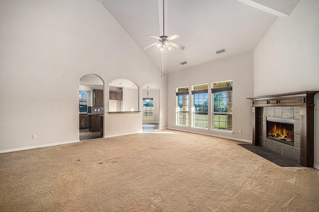 1432 Fence Post Dr, Fort Worth, TX 76052 - unfurnished living room with high vaulted ceiling, a tile fireplace, carpet floors, a ceiling fan, and baseboards