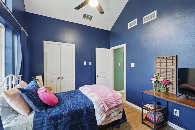 104 Radecke Rd, Krum, TX 76249 - bedroom with wood finished floors, high vaulted ceiling, a closet, ceiling fan, and baseboards