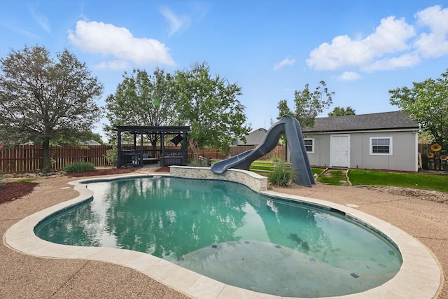 104 Radecke Rd, Krum, TX 76249 - view of pool featuring a water slide, a gazebo, and an outbuilding