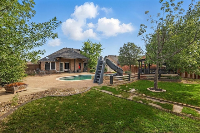 104 Radecke Rd, Krum, TX 76249 - view of swimming pool with a water slide and a patio