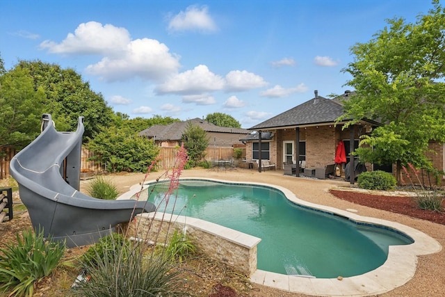 104 Radecke Rd, Krum, TX 76249 - view of swimming pool with a water slide, a patio area, and a fenced backyard
