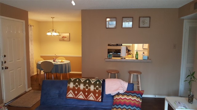 218 N Texas Blvd, Denton, TX 76201 - dining area with baseboards, wood finished floors, and a chandelier