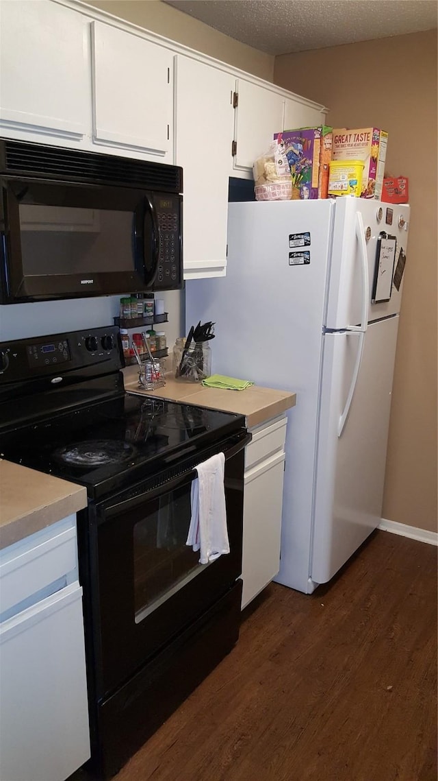 218 N Texas Blvd, Denton, TX 76201 - kitchen with black appliances, dark wood-style flooring, white cabinetry, and light countertops