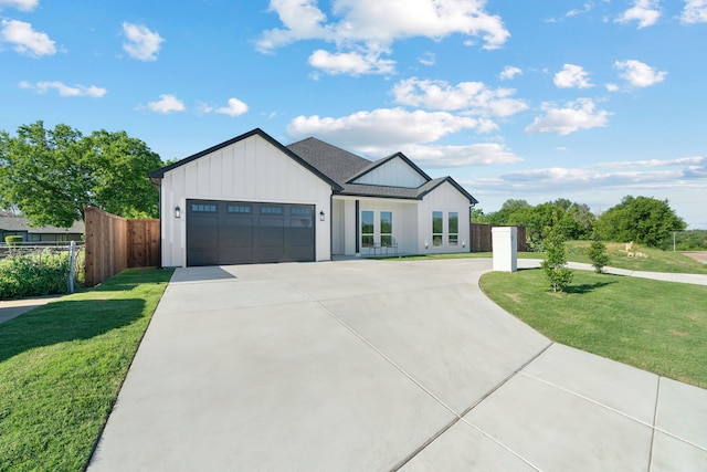 205 Altamesa Blvd, Fort Worth, TX 76134 - modern farmhouse style home featuring board and batten siding, an attached garage, and concrete driveway
