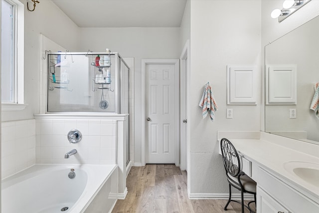1505 Oakcrest Dr, Providence Village, TX 76227 - bathroom featuring a shower stall, a bath, wood finished floors, baseboards, and vanity