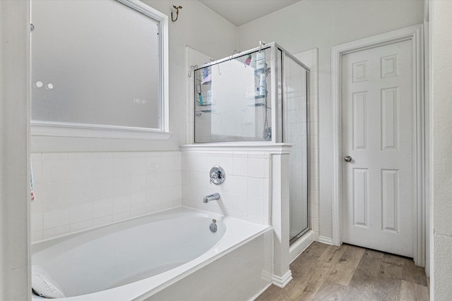 1505 Oakcrest Dr, Providence Village, TX 76227 - bathroom featuring wood finished floors, a stall shower, and a garden tub