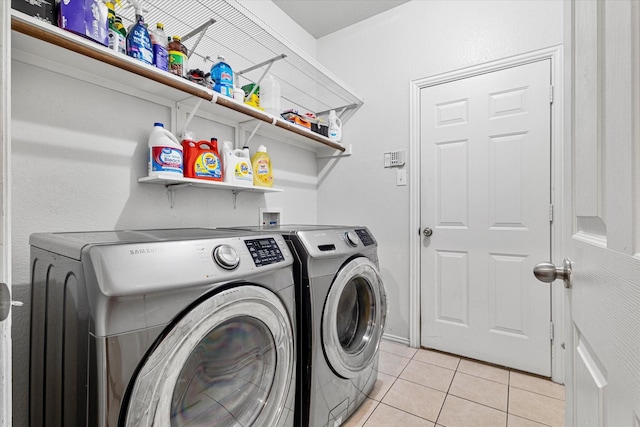 1505 Oakcrest Dr, Providence Village, TX 76227 - clothes washing area with washing machine and clothes dryer and light tile patterned flooring