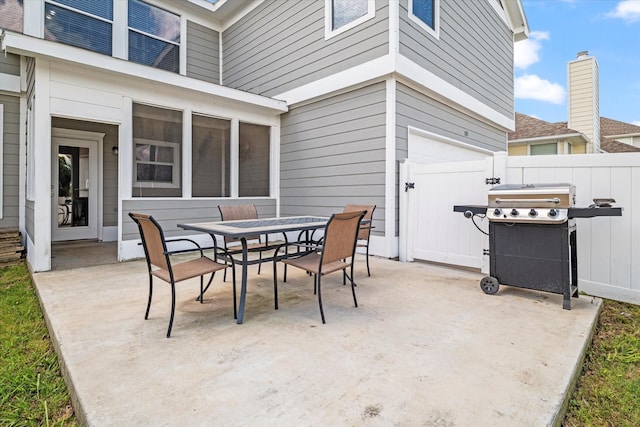 1505 Oakcrest Dr, Providence Village, TX 76227 - view of patio featuring outdoor dining space, fence, and a grill