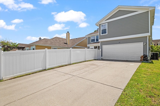 1505 Oakcrest Dr, Providence Village, TX 76227 - view of property exterior featuring a garage, fence, driveway, and central air condition unit