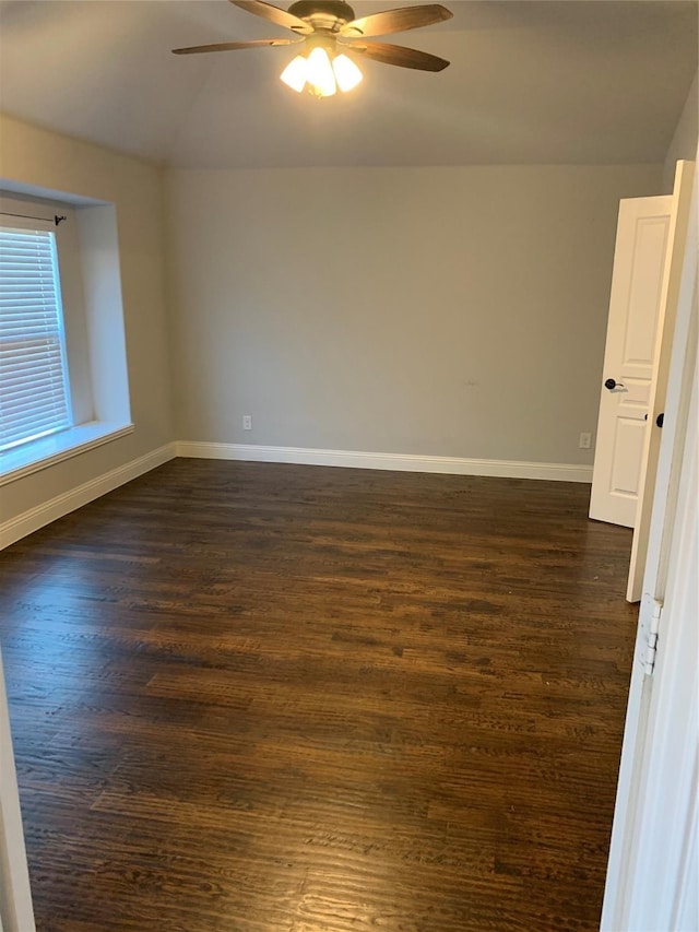 1609 Emerald Tree Pl, Aubrey, TX 76227 - empty room featuring a ceiling fan, lofted ceiling, dark wood-style flooring, and baseboards
