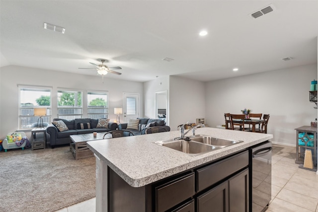 16417 Marinette Ct, Justin, TX 76247 - kitchen featuring a sink, dishwasher, open floor plan, light countertops, and dark brown cabinetry