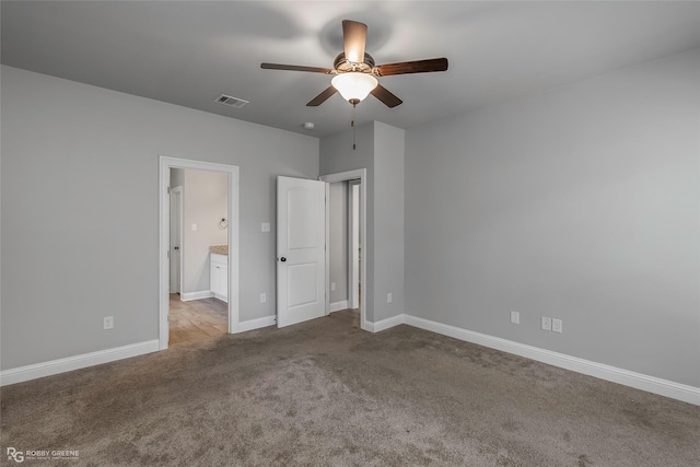 345 Coppice Pl, Bossier City, LA 71111 - unfurnished bedroom featuring carpet, baseboards, ensuite bathroom, and a ceiling fan