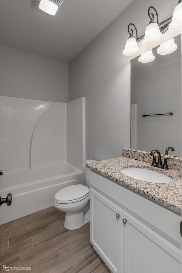 345 Coppice Pl, Bossier City, LA 71111 - full bathroom with vanity, wood finished floors, bathtub / shower combination, and toilet