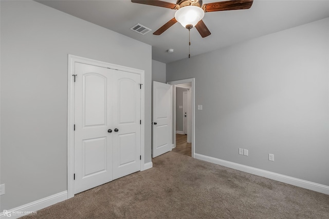 345 Coppice Pl, Bossier City, LA 71111 - unfurnished bedroom with carpet, baseboards, a closet, and a ceiling fan