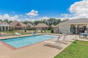 345 Coppice Pl, Bossier City, LA 71111 - community pool featuring a patio and fence