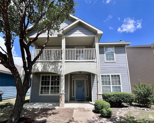 11040 Kinston St, Fort Worth, TX 76179 - townhome / multi-family property featuring a balcony and covered porch