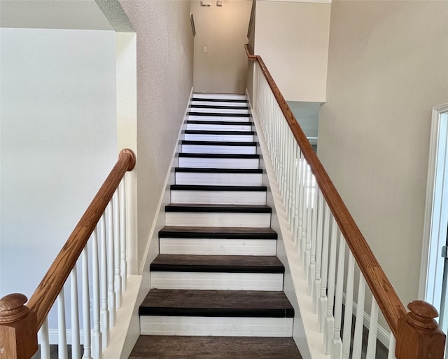 11040 Kinston St, Fort Worth, TX 76179 - stairway featuring a high ceiling and wood finished floors