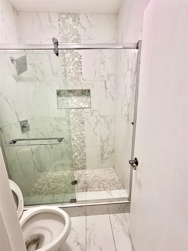 full bathroom with a stall shower and toilet
