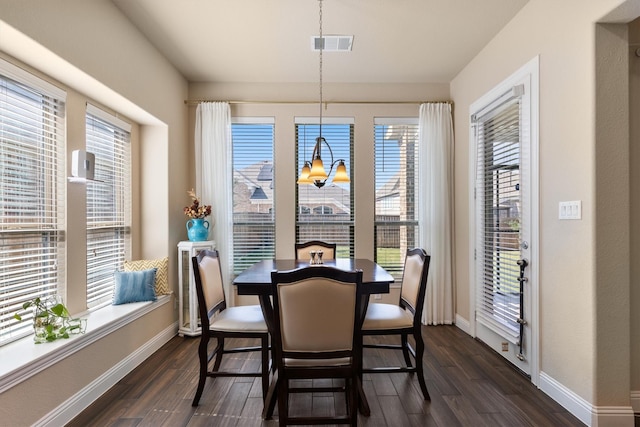 102 Autumn Sage Dr, Wylie, TX 75098 - dining area featuring dark wood-style flooring, plenty of natural light, and baseboards
