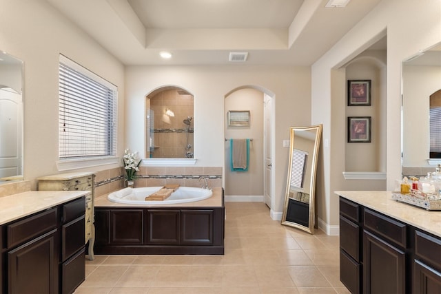 102 Autumn Sage Dr, Wylie, TX 75098 - bathroom with tile patterned floors, a tray ceiling, a garden tub, a tile shower, and baseboards
