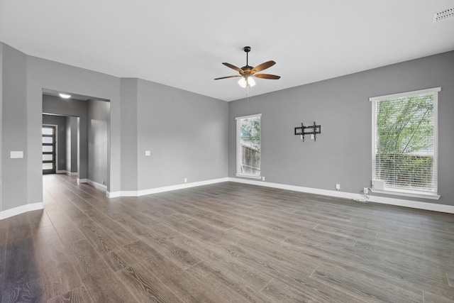 300 Navo Rd, Little Elm, TX 75068 - unfurnished living room featuring ceiling fan, wood finished floors, and baseboards