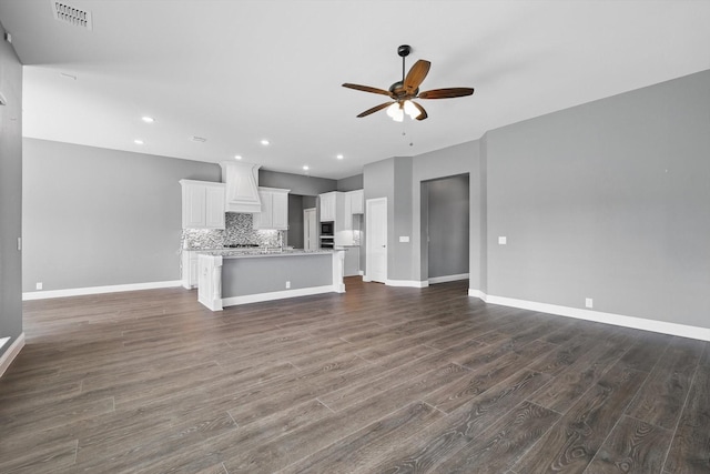 300 Navo Rd, Little Elm, TX 75068 - unfurnished living room with a ceiling fan, dark wood-style floors, baseboards, and recessed lighting