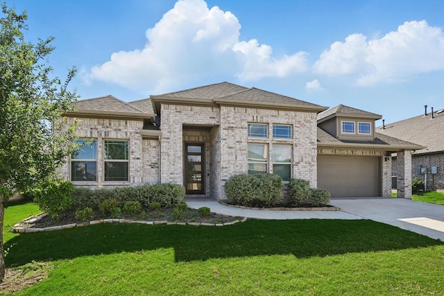 300 Navo Rd, Little Elm, TX 75068 - french country home featuring brick siding, driveway, a garage, a front lawn, and a shingled roof