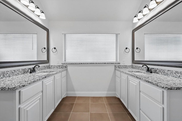 300 Navo Rd, Little Elm, TX 75068 - full bathroom featuring two vanities, tile patterned floors, and baseboards
