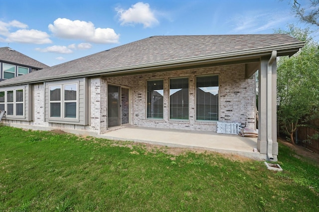 300 Navo Rd, Little Elm, TX 75068 - rear view of property featuring a yard, a patio area, brick siding, and roof with shingles