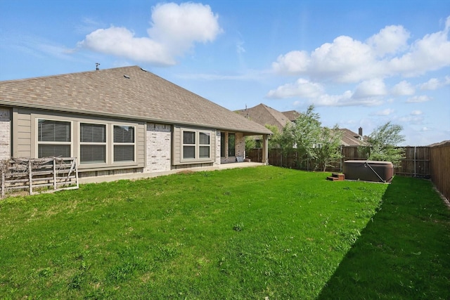 300 Navo Rd, Little Elm, TX 75068 - rear view of house with a hot tub, brick siding, a patio, and roof with shingles