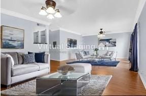 534 E Ave J Unit A, Grand Prairie, TX 75050 - living room featuring a ceiling fan, wood finished floors, baseboards, a chandelier, and ornamental molding