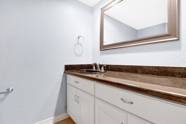 534 E Ave J Unit A, Grand Prairie, TX 75050 - bathroom with vanity, baseboards, and tile patterned flooring