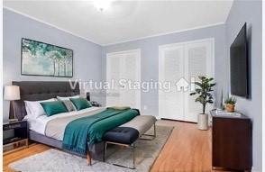 534 E Ave J Unit A, Grand Prairie, TX 75050 - bedroom featuring wood finished floors and ornamental molding