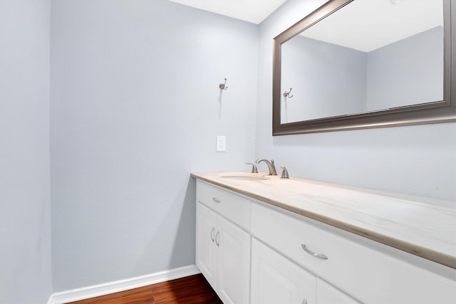 534 E Ave J Unit A, Grand Prairie, TX 75050 - bathroom featuring baseboards, vanity, and wood finished floors