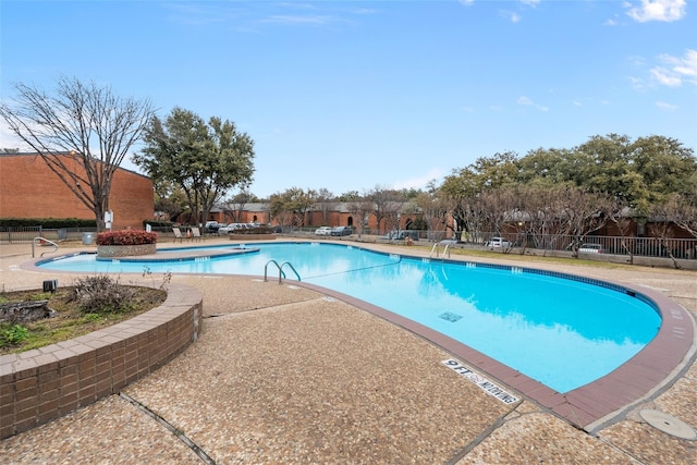 534 E Ave J Unit A, Grand Prairie, TX 75050 - community pool with fence and a patio area