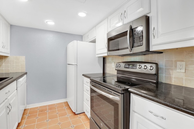 534 E Ave J Unit A, Grand Prairie, TX 75050 - kitchen with stainless steel appliances, white cabinets, backsplash, recessed lighting, and baseboards