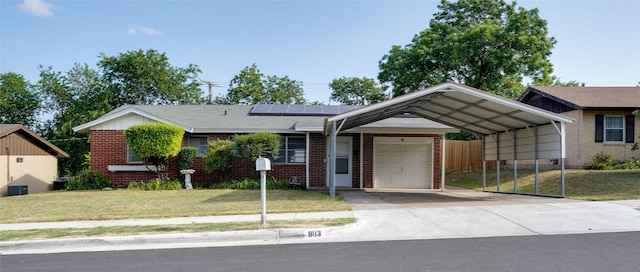 8113 Tumbleweed Trl, White Settlement, TX 76108 - ranch-style house with driveway, brick siding, and roof mounted solar panels