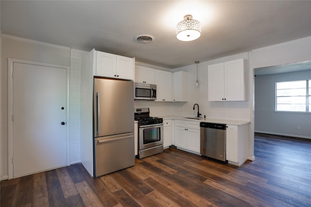 8113 Tumbleweed Trl, White Settlement, TX 76108 - kitchen featuring appliances with stainless steel finishes, a sink, white cabinetry, backsplash, and light countertops