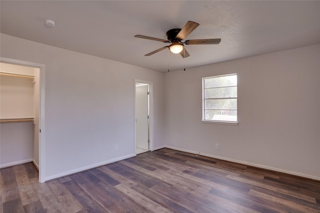 8113 Tumbleweed Trl, White Settlement, TX 76108 - unfurnished bedroom featuring wood finished floors, baseboards, a walk in closet, ceiling fan, and a closet