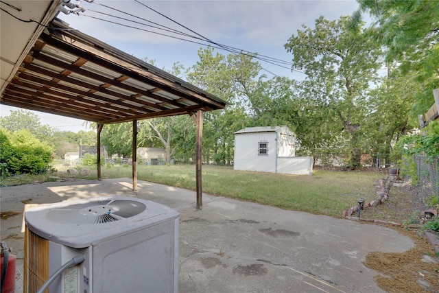 8113 Tumbleweed Trl, White Settlement, TX 76108 - view of patio / terrace with a shed, cooling unit, an outbuilding, and a jacuzzi