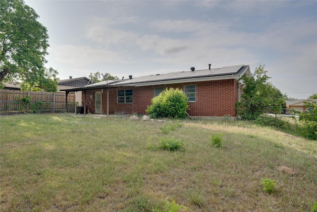 8113 Tumbleweed Trl, White Settlement, TX 76108 - rear view of property with brick siding and solar panels