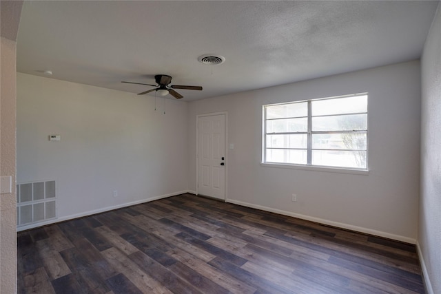 8113 Tumbleweed Trl, White Settlement, TX 76108 - empty room featuring dark wood-style floors, ceiling fan, and baseboards