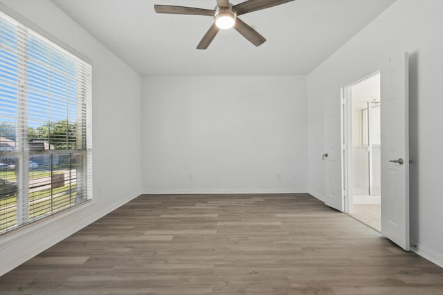 1228 Carriage Creek Dr, Desoto, TX 75115 - spare room featuring wood finished floors, a ceiling fan, and baseboards