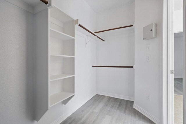 1228 Carriage Creek Dr, Desoto, TX 75115 - walk in closet with wood finished floors