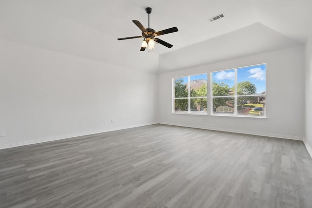 1228 Carriage Creek Dr, Desoto, TX 75115 - empty room featuring wood finished floors, ceiling fan, lofted ceiling, and baseboards