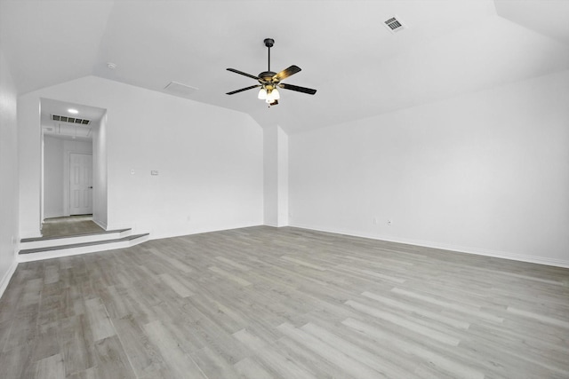 1228 Carriage Creek Dr, Desoto, TX 75115 - unfurnished living room with attic access, lofted ceiling, wood finished floors, a ceiling fan, and baseboards