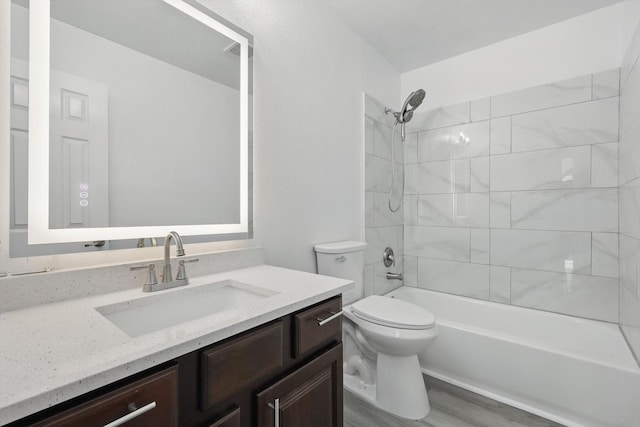1228 Carriage Creek Dr, Desoto, TX 75115 - bathroom featuring toilet, vanity, shower / tub combination, and wood finished floors