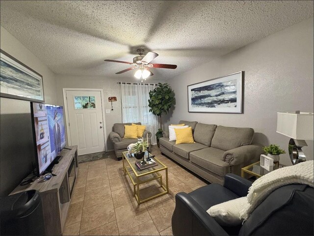 6060 County Road 3925, Athens, TX 75752 - living area with a ceiling fan, a textured ceiling, and light tile patterned floors