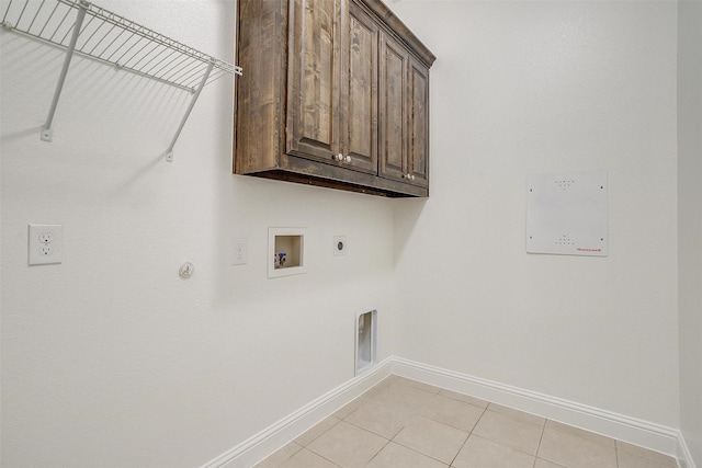 5232 Buffalo Gap Trl, Fort Worth, TX 76126 - laundry area with cabinet space, hookup for an electric dryer, baseboards, gas dryer hookup, and hookup for a washing machine